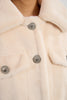Cream fur with jewel button detail by Molly Bracken