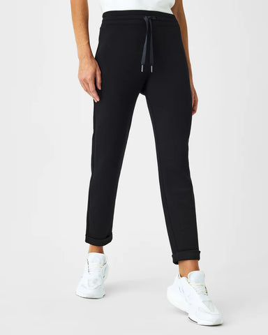 Air essentials tapered pant in very black by Spanx