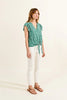 Printed blouse tied at front in green Diane by Molly Bracken