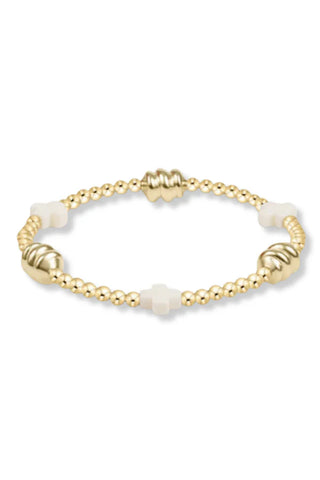 Signature cross admire gold pattern 3mm bead bracelet off white By: Enewton