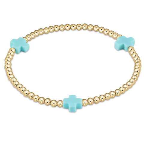 Signature cross 3mm bead bracelet in turquoise by Enewton